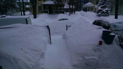 Do you see top of the car buried in mound of the snow?