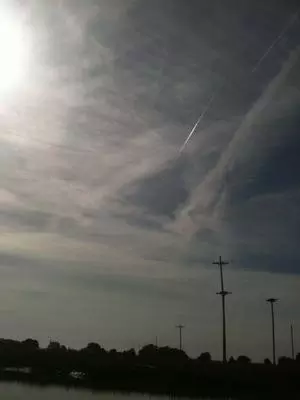 Plane creating cloud to cover colors
